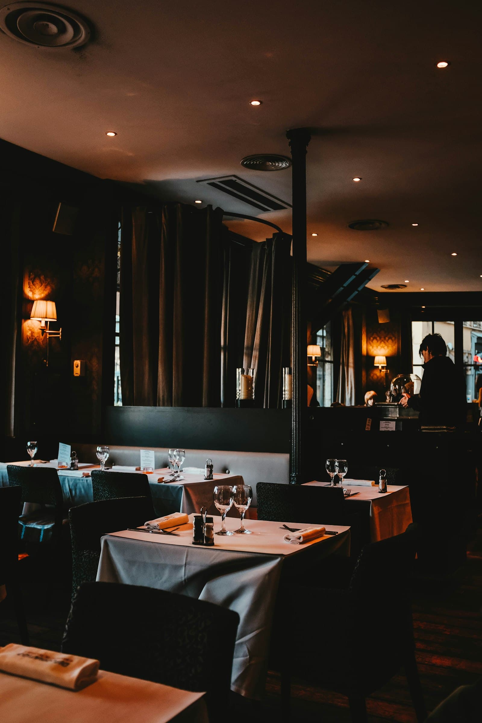 The warm, candle-lit dining room and bar at Farnesi's